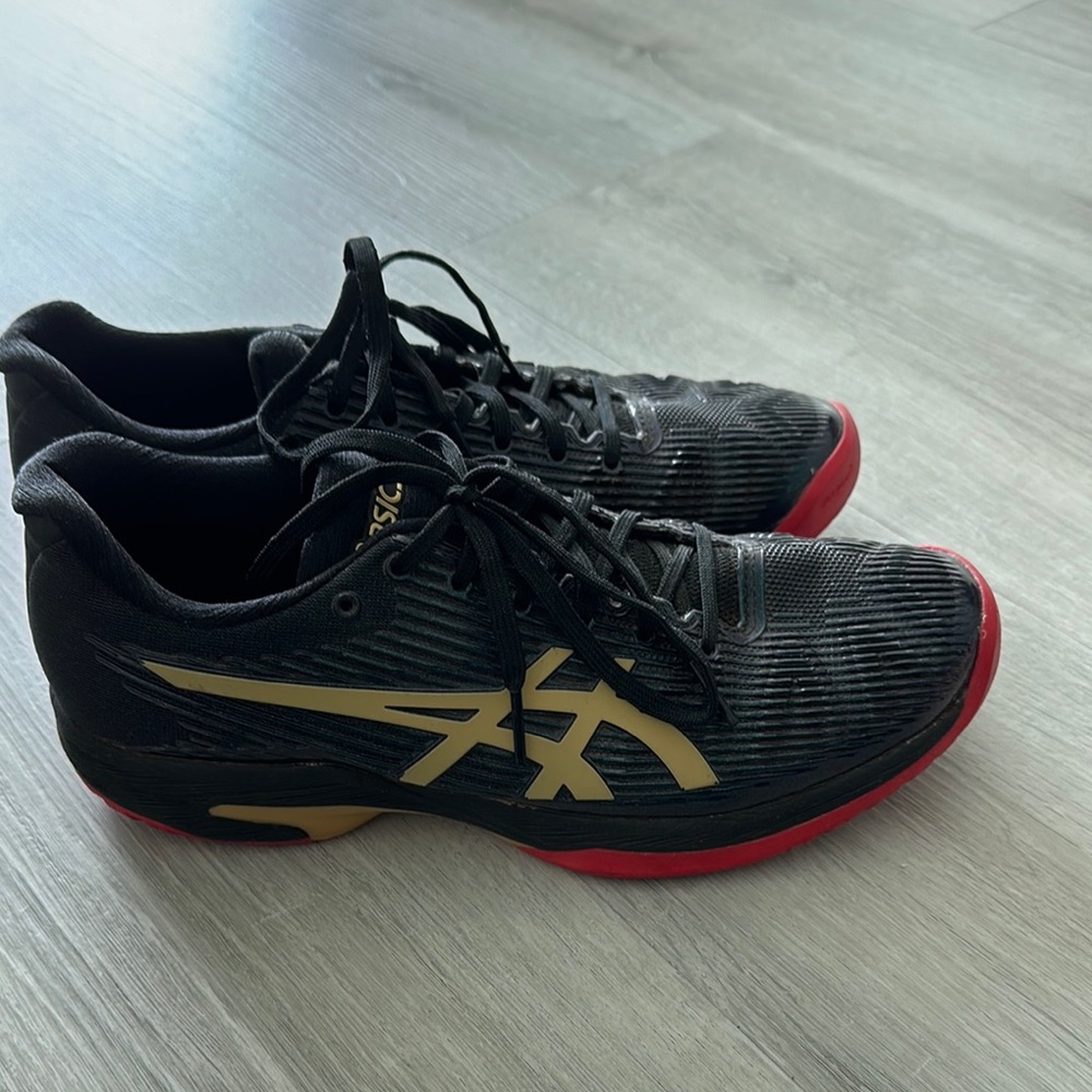 Asics Black and Gold Athletic Shoes with Sleek Design